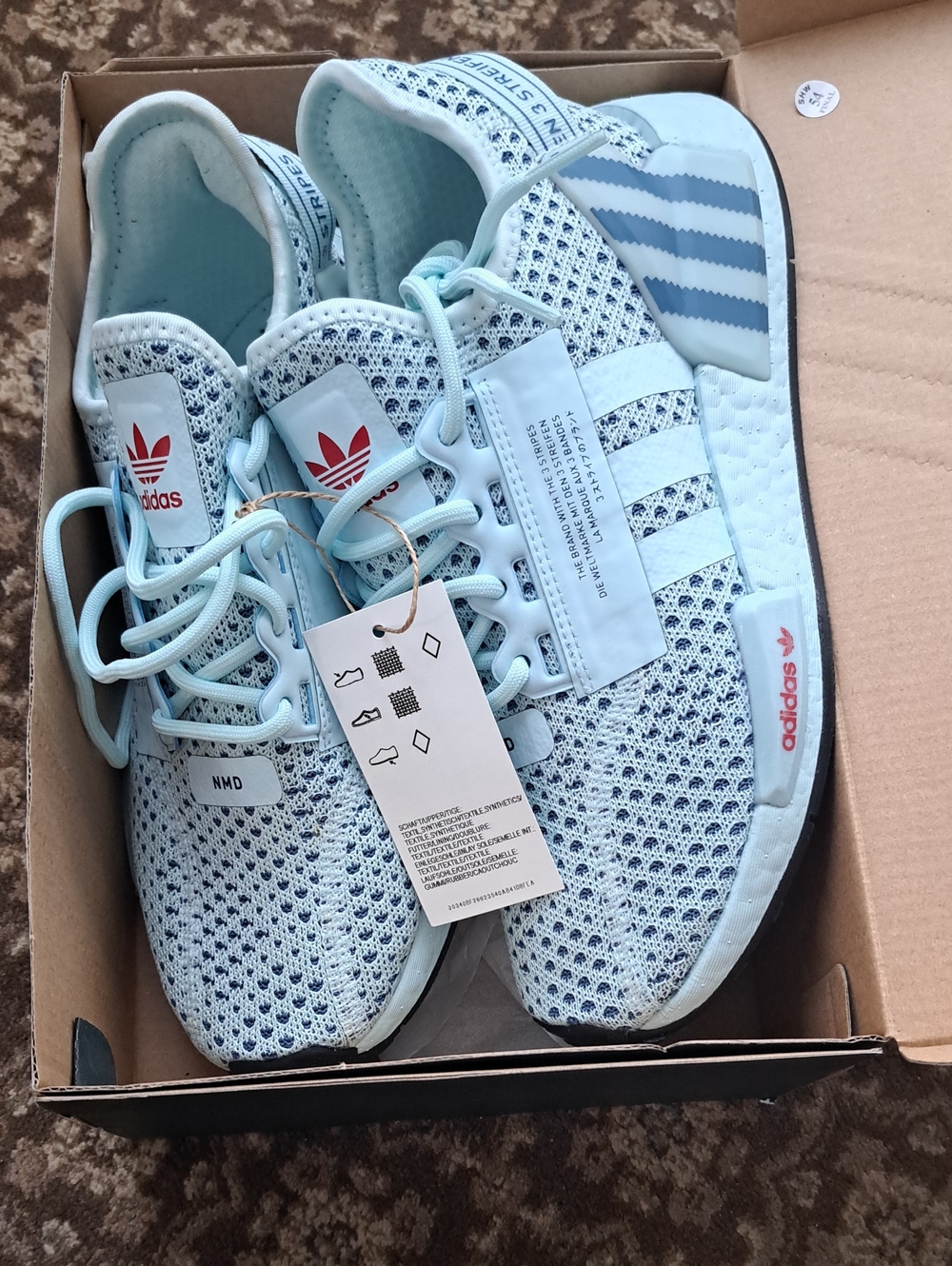 adidas NMD R1 Knit Sneakers in Light Blue with White Accents
